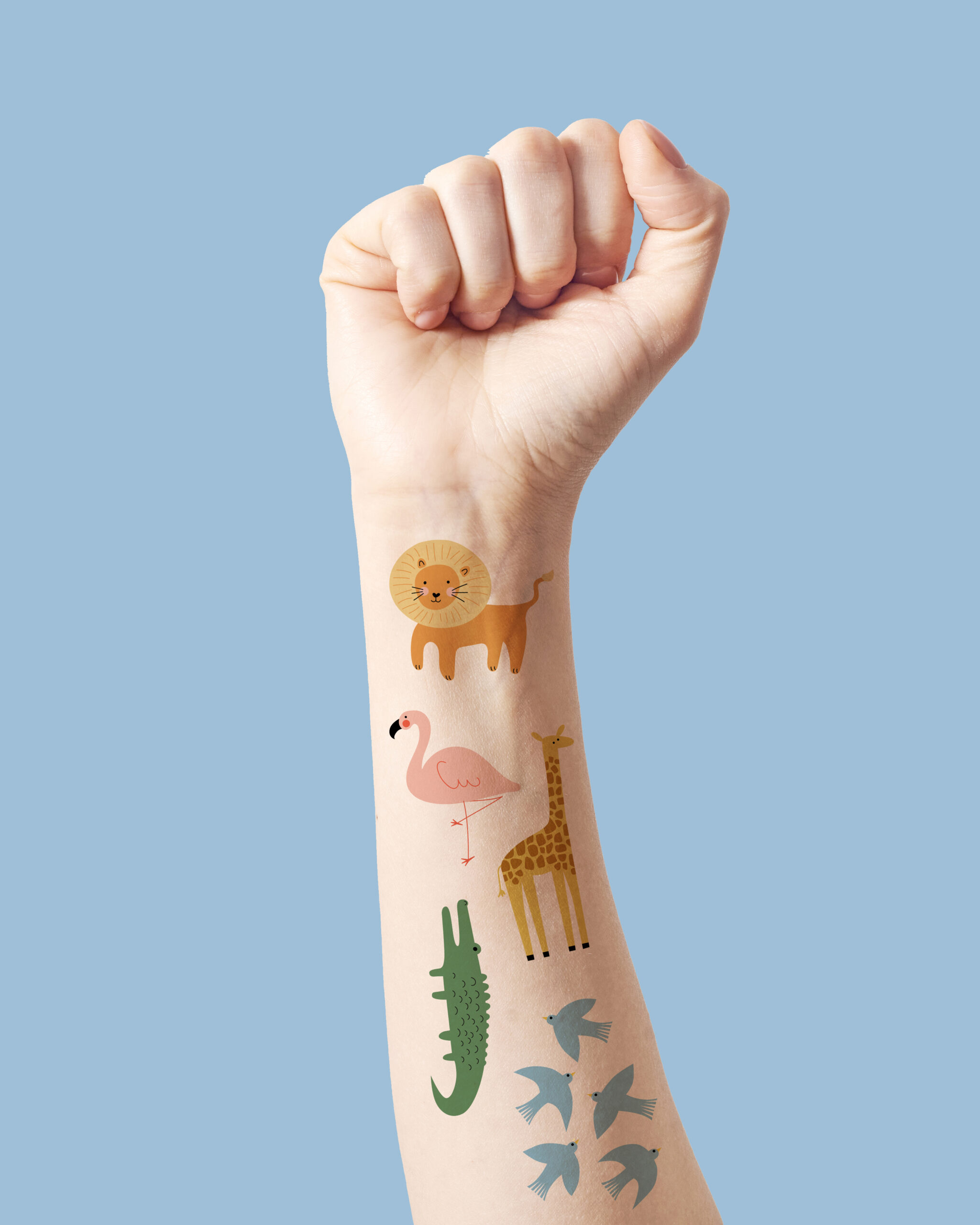 Female hand clenched fist raised up in victory, isolated on a white background.